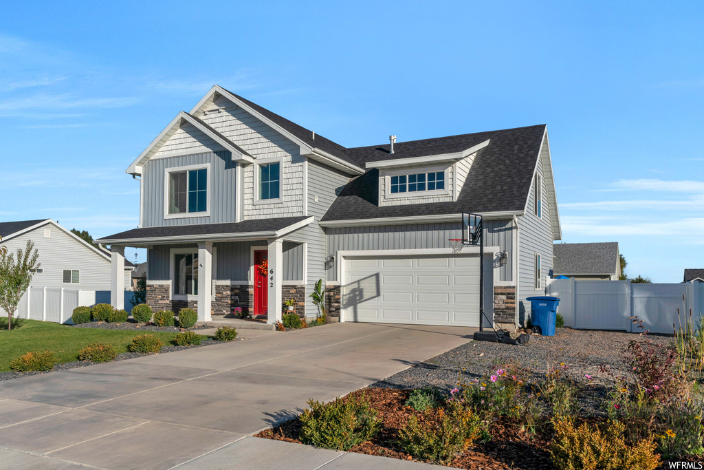 Craftsman-style home featuring a garage