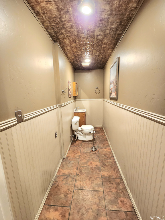 Bathroom featuring tile flooring and toilet