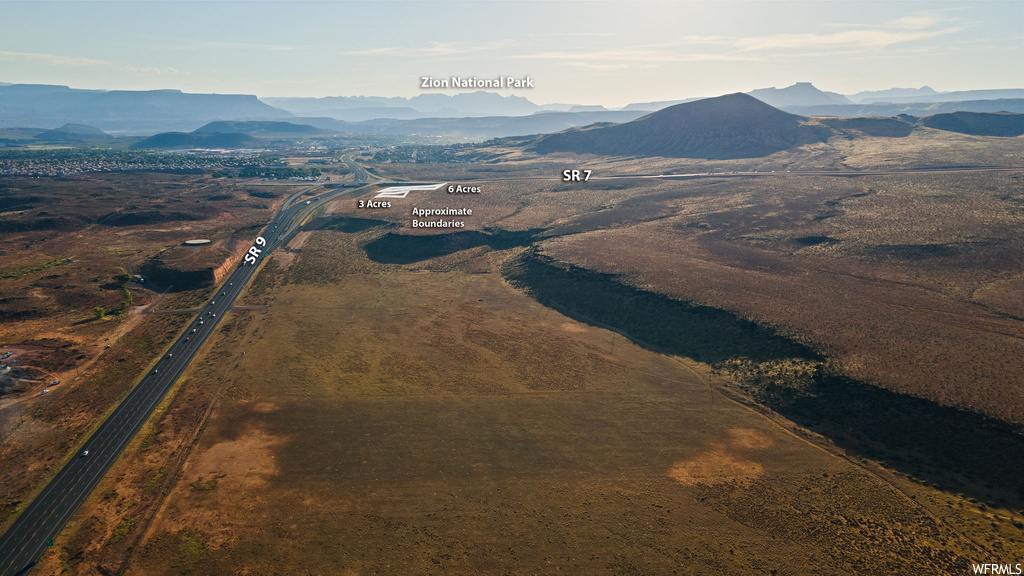 Birds eye view of property with a mountain view