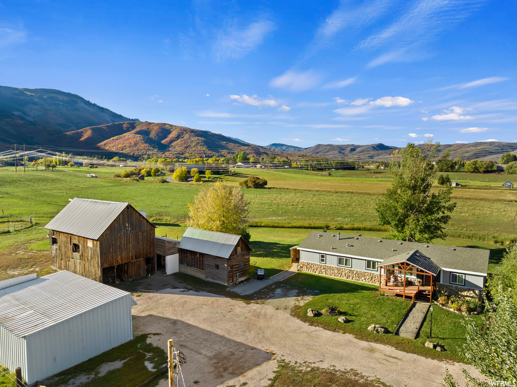 Exterior space with a rural view and a mountain view