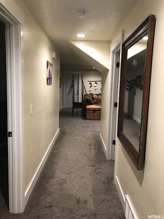 Corridor with dark carpet