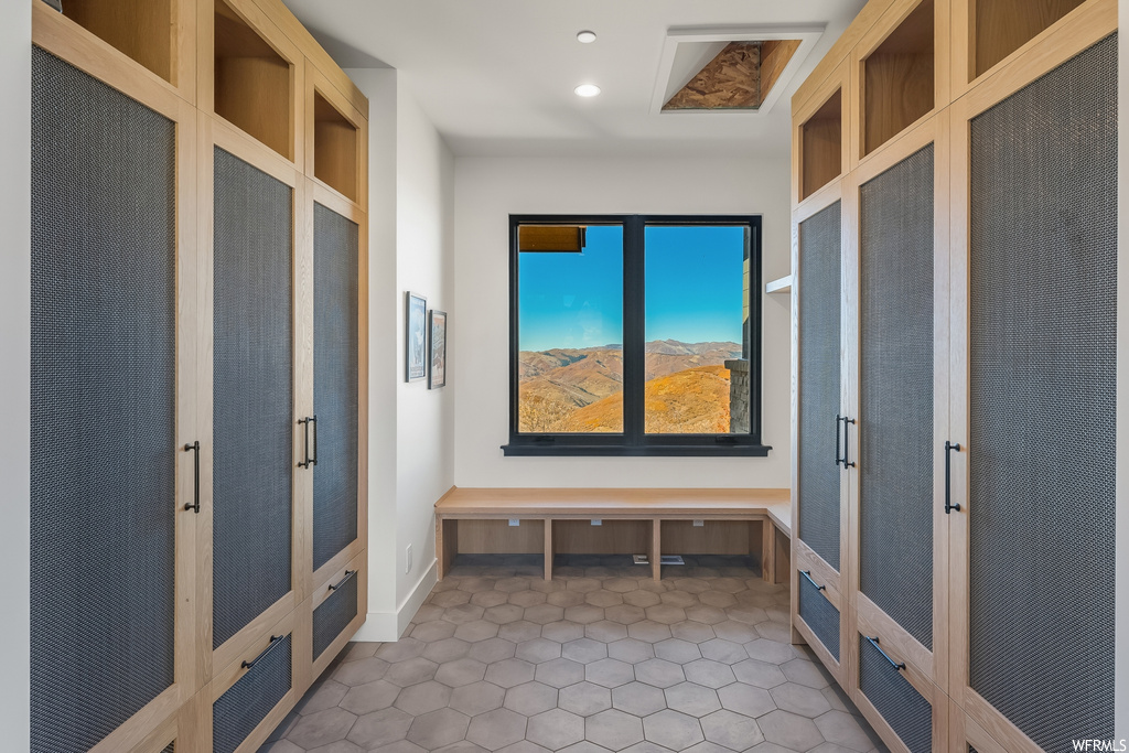 Mudroom featuring tile floors