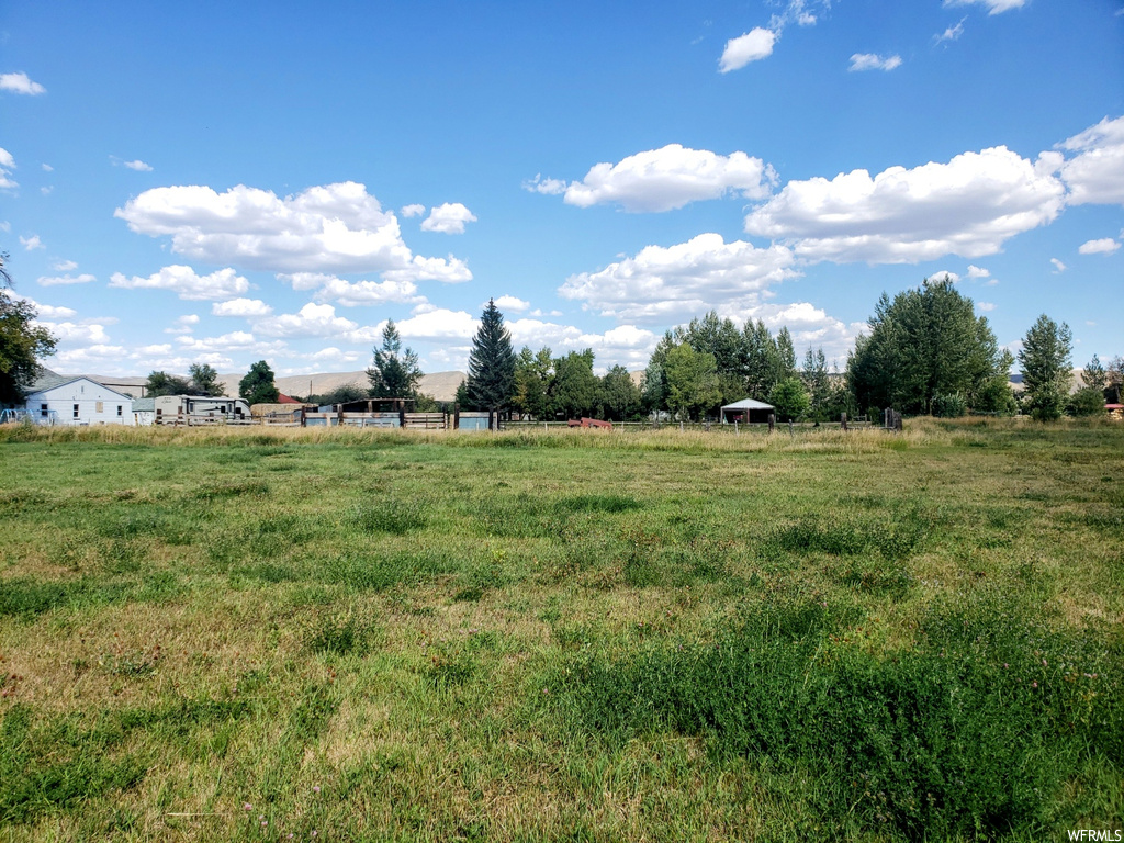 View of yard with a rural view