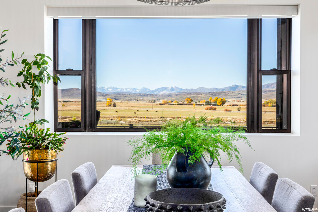 Dining room with a mountain view and a rural view