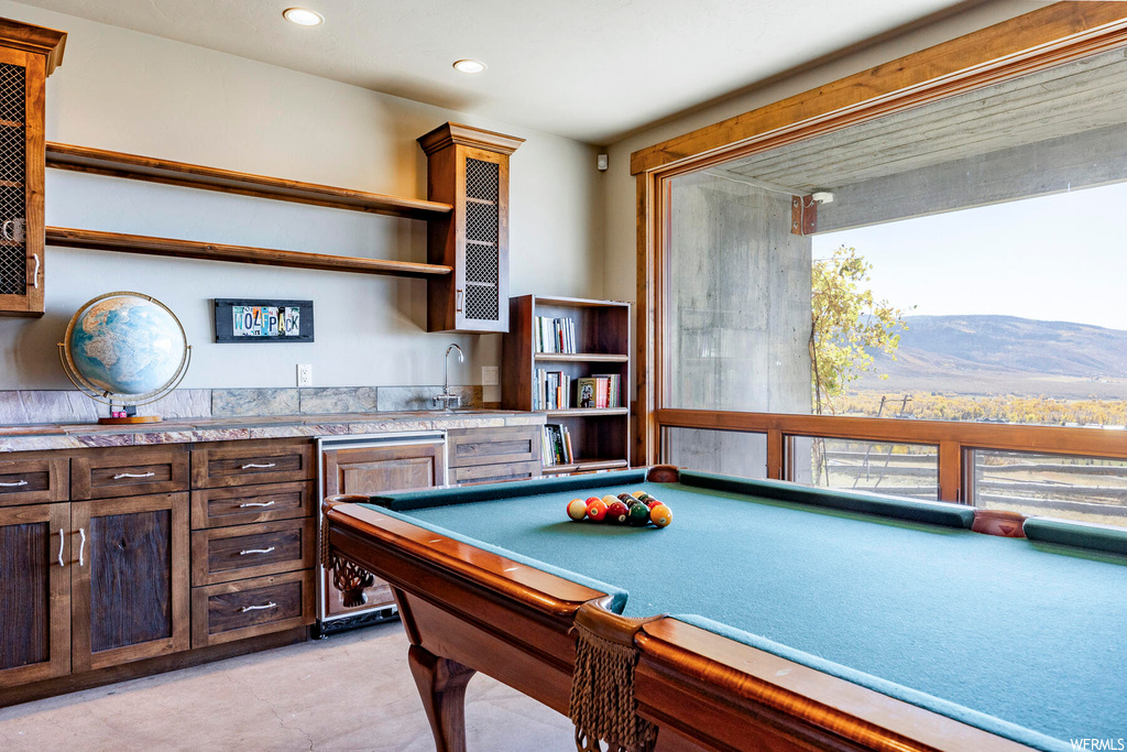 Rec room featuring billiards, a mountain view, and light tile flooring