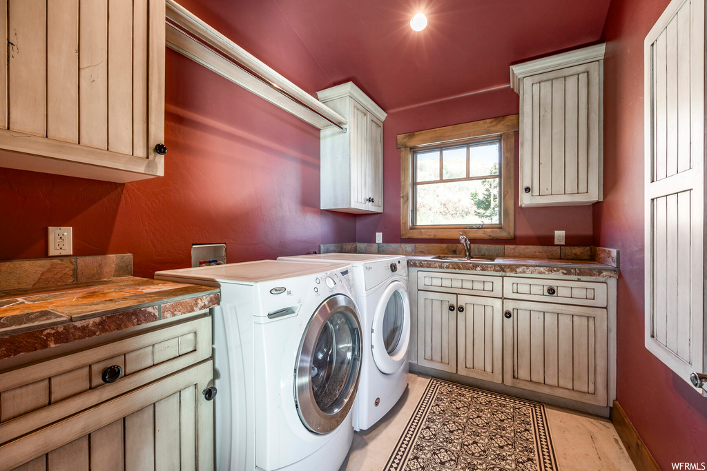 Clothes washing area with hookup for a washing machine, independent washer and dryer, and cabinets