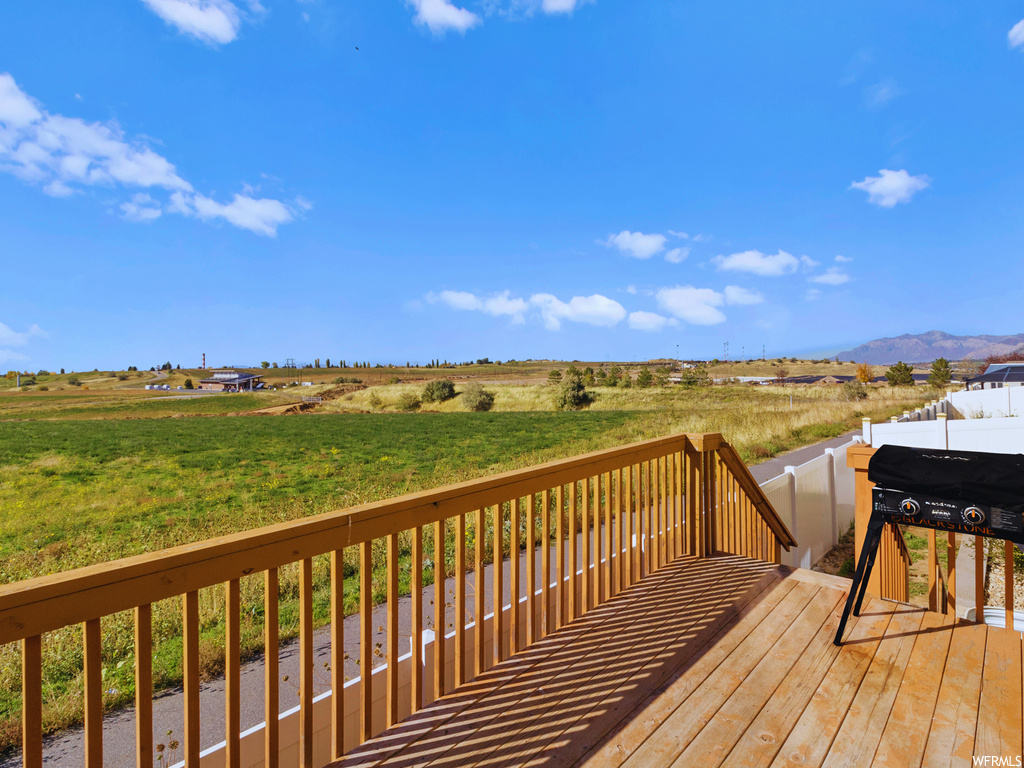 Wooden deck with a rural view