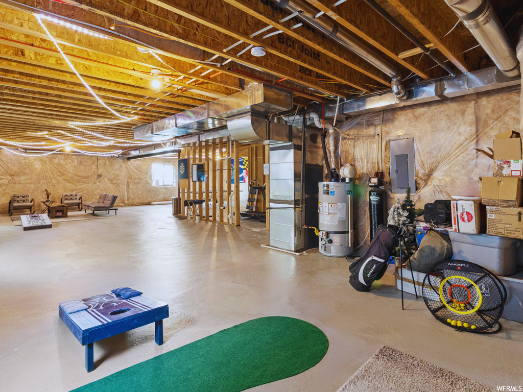 Basement featuring water heater and heating utilities