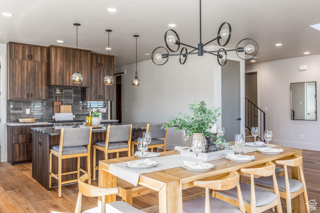 Dining room featuring light hardwood / wood-style flooring and a chandelier