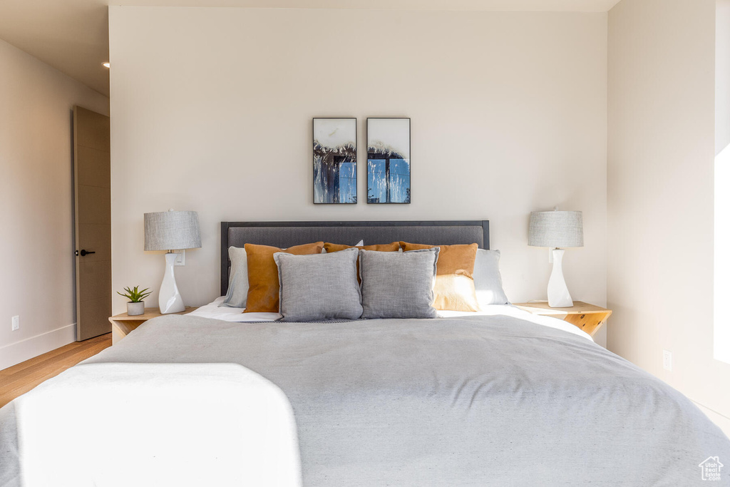 Bedroom with hardwood / wood-style floors