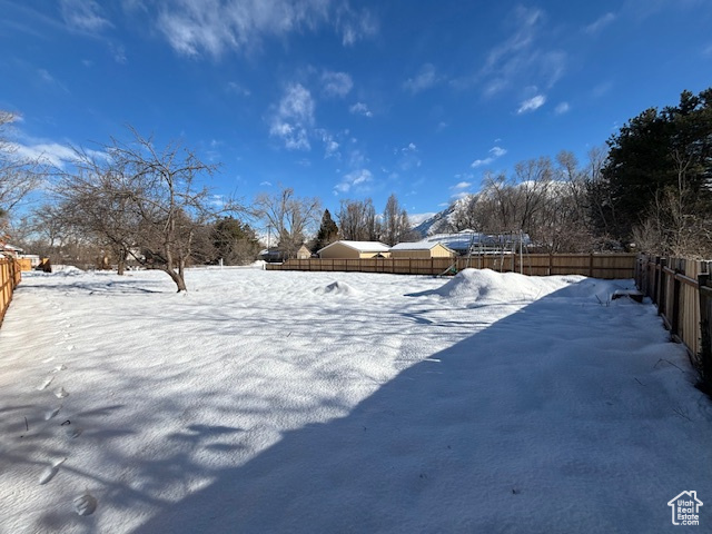 View of yard covered in snow