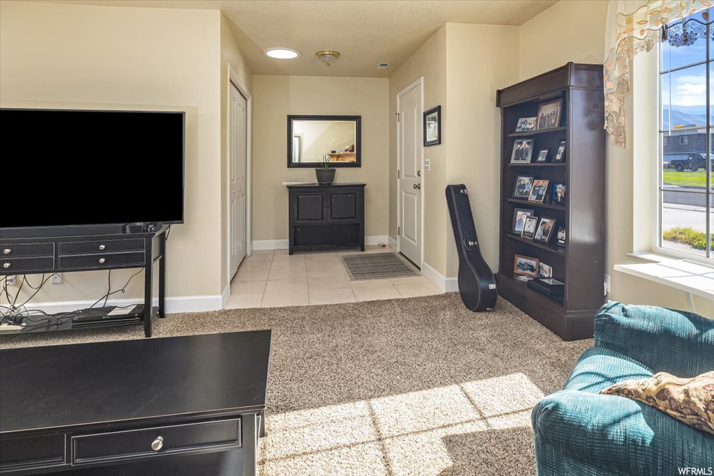 Foyer entrance featuring light tile floors