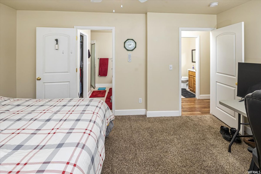 Bedroom featuring carpet floors and ensuite bathroom