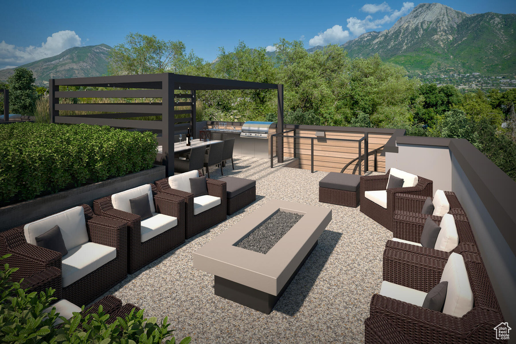 View of patio featuring a mountain view and an outdoor hangout area