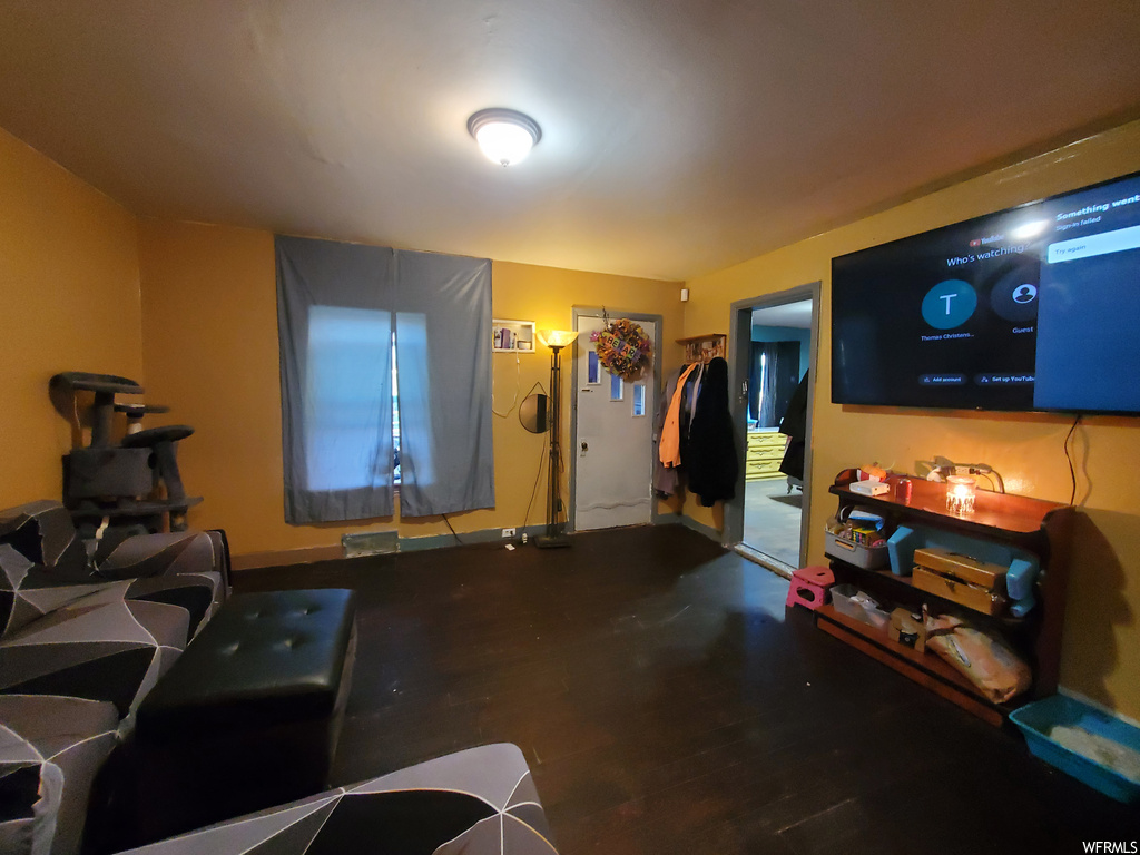 Living room featuring wood-type flooring