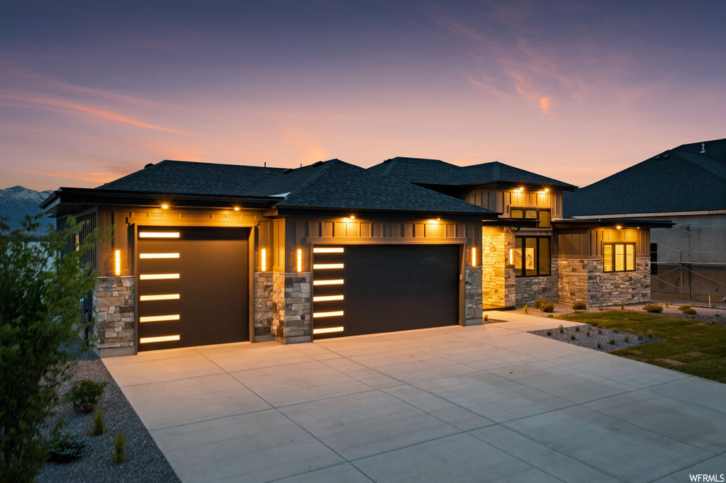 Prairie-style home featuring a garage