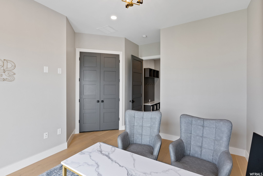 Living area featuring light wood-type flooring