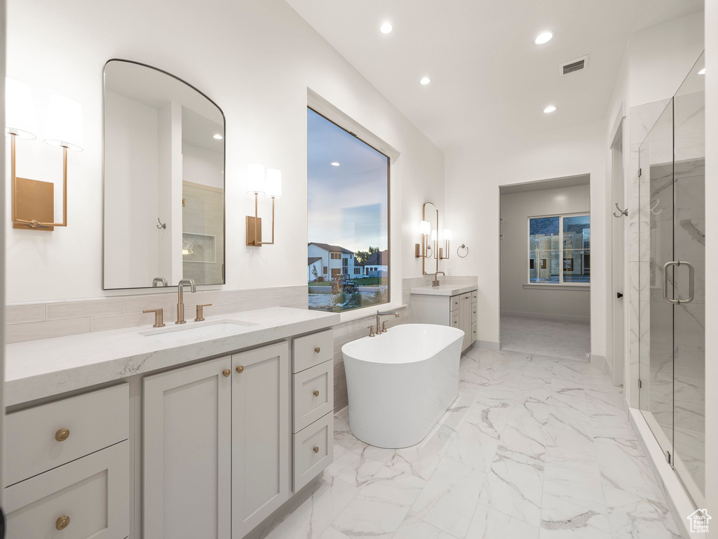 Bathroom with vanity, plus walk in shower, and tile patterned floors