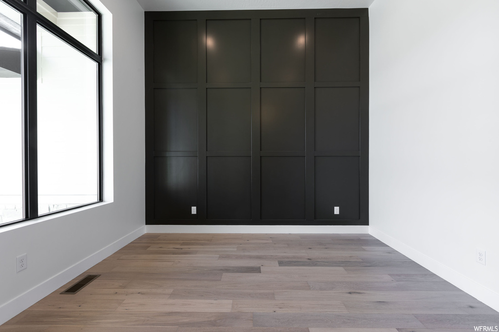 Interior space with a closet and light hardwood / wood-style flooring