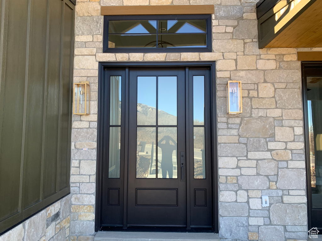 View of exterior entry featuring french doors