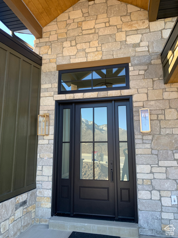 Entrance to property featuring a mountain view and french doors