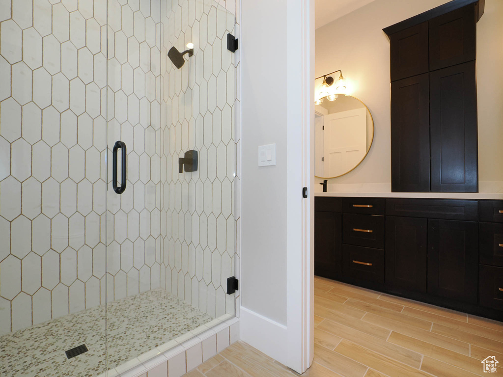 Bathroom with large vanity and an enclosed shower
