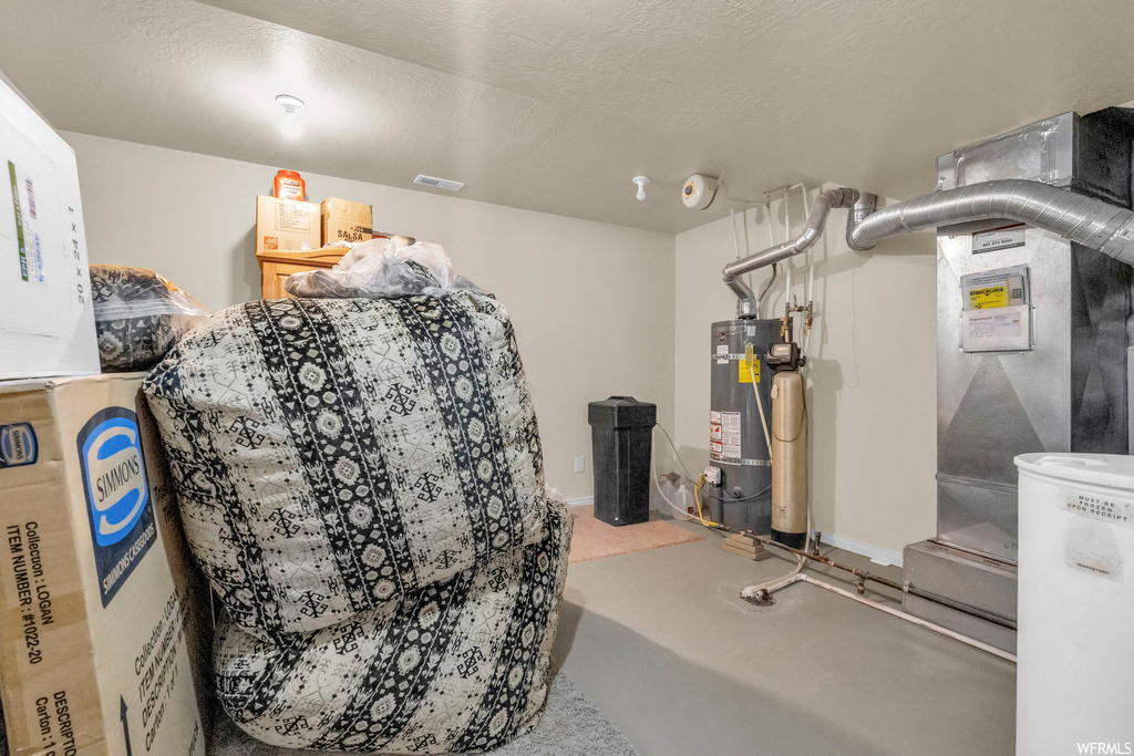 Interior space with strapped water heater