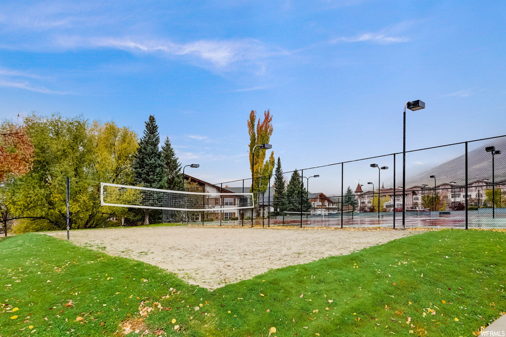 View of property\'s community with volleyball court and a yard