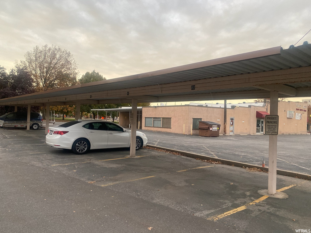 View of vehicle parking with a carport