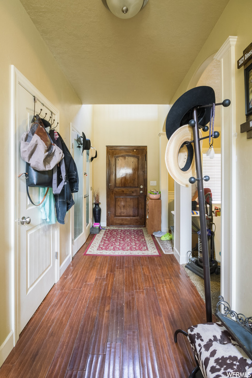 Entrance foyer featuring dark hardwood / wood-style floors