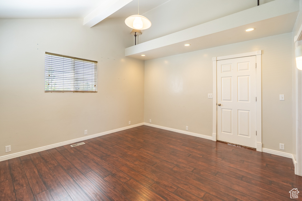 Spare room with wood-type flooring, baseboards, and recessed lighting