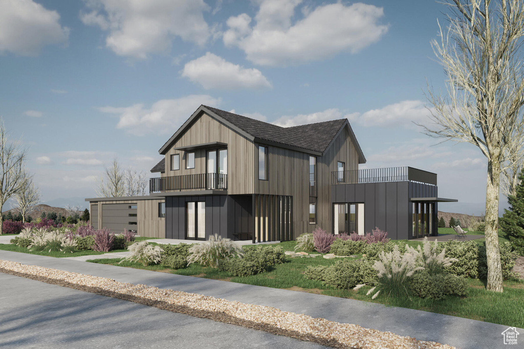 View of front of property with a garage and a balcony