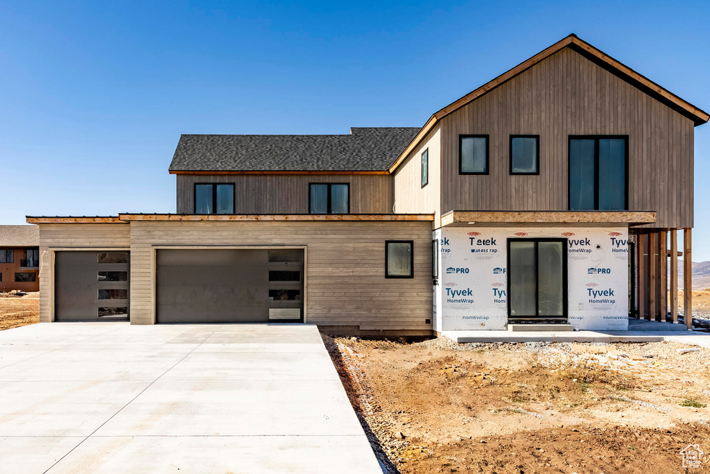 View of front of property featuring a garage