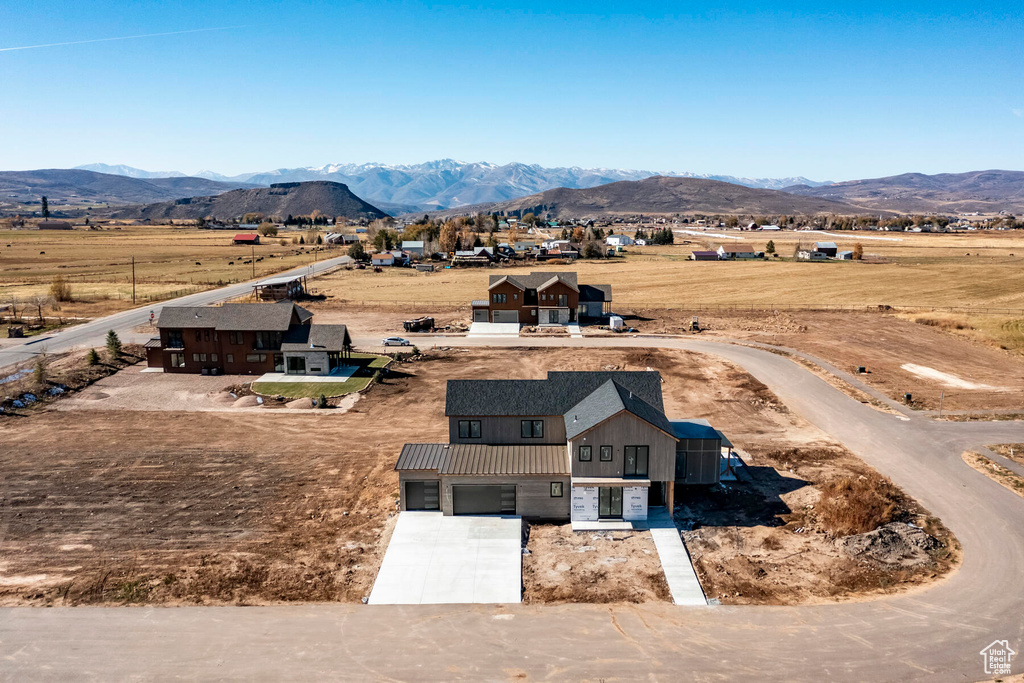 Birds eye view of property featuring a rural view and a mountain view