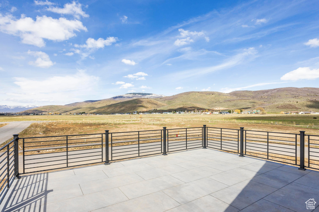 View of patio with a mountain view and a rural view