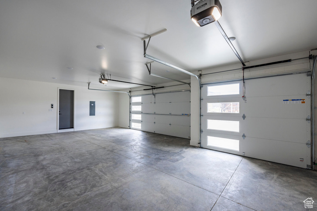 Garage with a garage door opener and electric panel