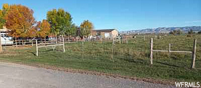 View of gate featuring a rural view