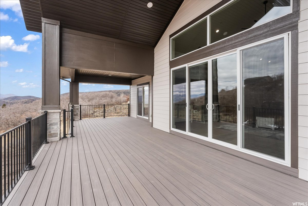 Wooden terrace featuring a mountain view