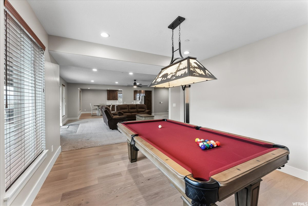 Playroom with light hardwood / wood-style floors, pool table, and ceiling fan