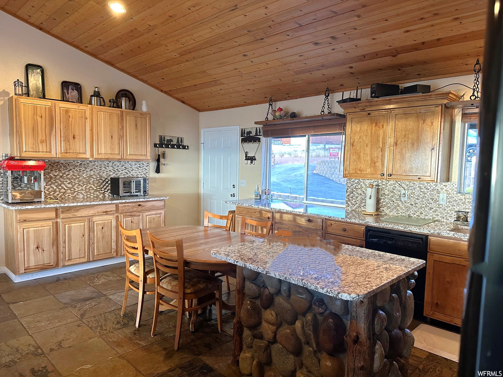 Kitchen featuring vaulted ceiling, backsplash, wooden ceiling, and dark tile flooring