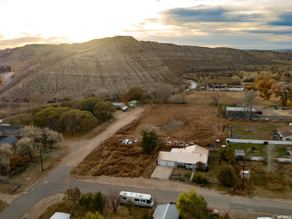 Aerial view at dusk featuring a mountain view