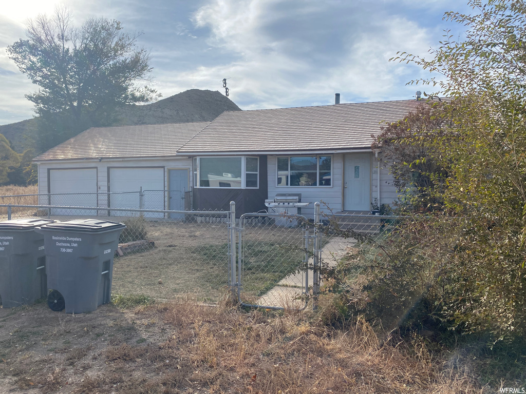 Ranch-style home with a garage