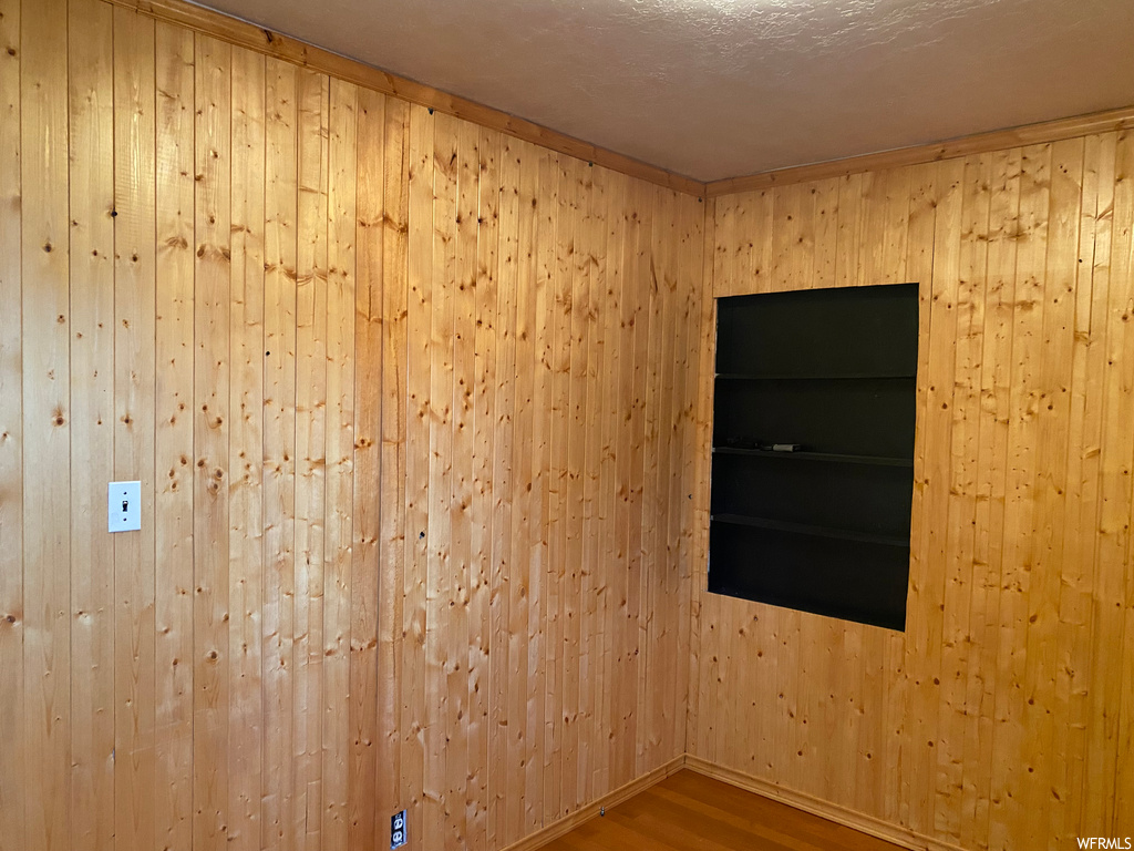 Empty room with wood-type flooring