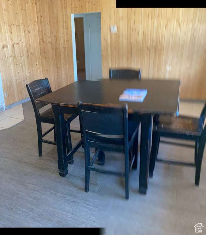 Dining area with wooden walls