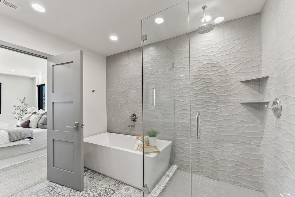 Bathroom with independent shower and bath and tile floors