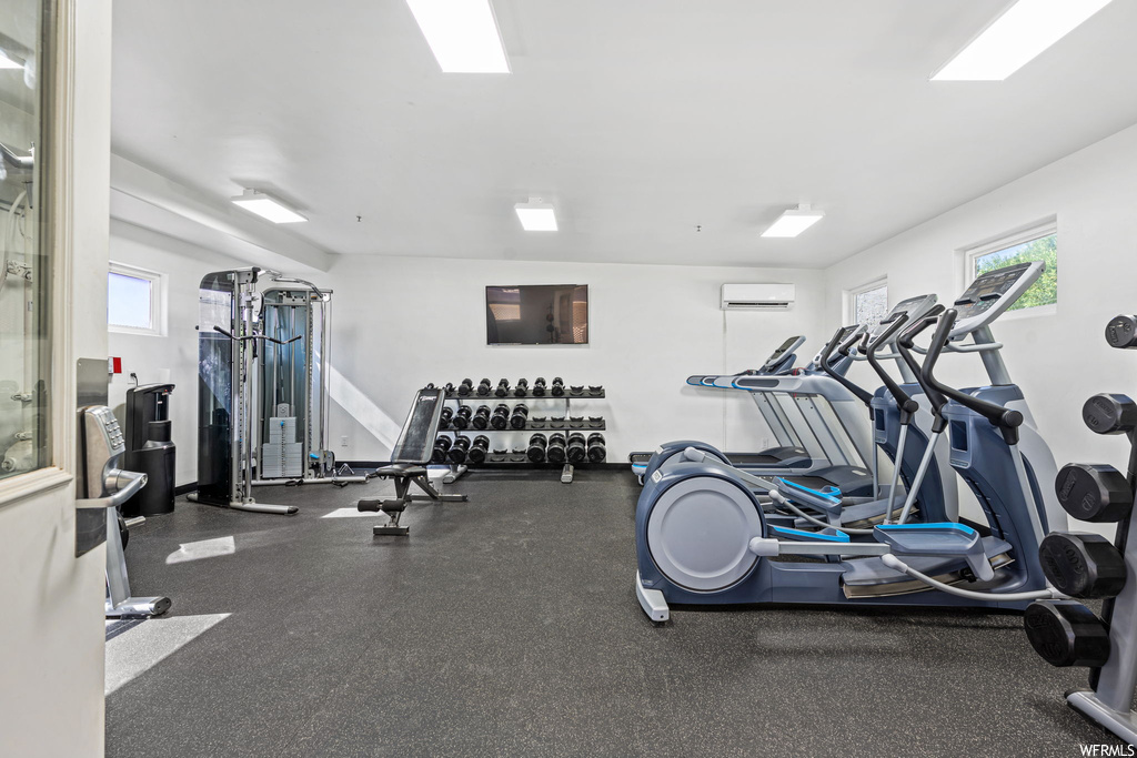 Exercise room with a wall mounted AC