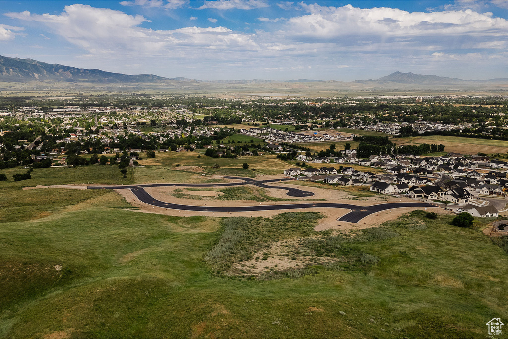 Birds eye view of property with a mountain view