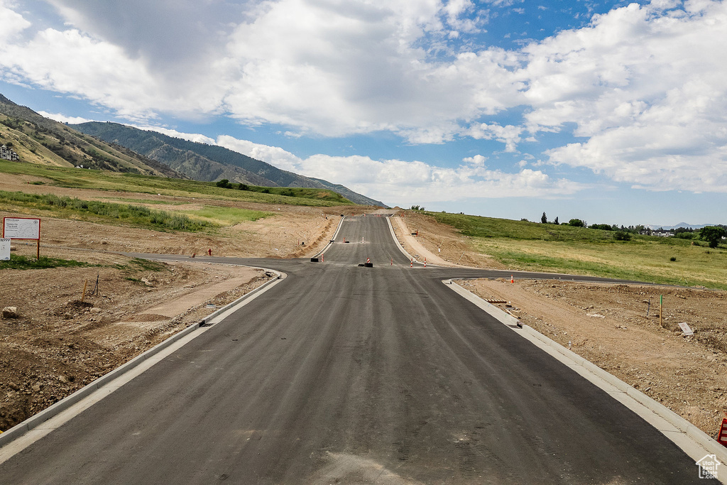 View of street featuring a rural view and a mountain view
