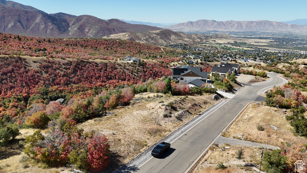 Birds eye view of property with a mountain view