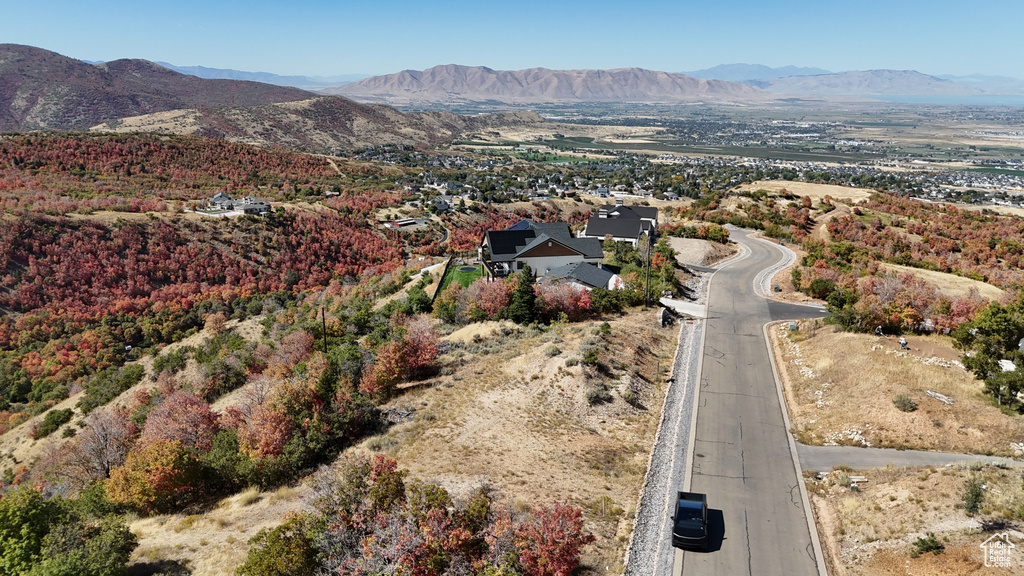 Birds eye view of property with a mountain view